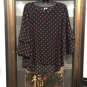 pink blouse with black polka dots