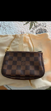 Louis Vuitton Mini Pochette Accessoires Damier Ebene Red Interior Brown Canvas
