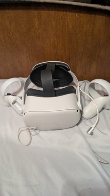 Meta quest 2 with elite strap and charging pack. Controllers included.