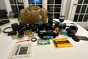Lot of Vintage Cameras, Lenses, Flashes, Film and Leather Case With key