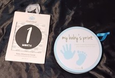   drop  Baby milestone items.  Never used.  tin has stain from storage