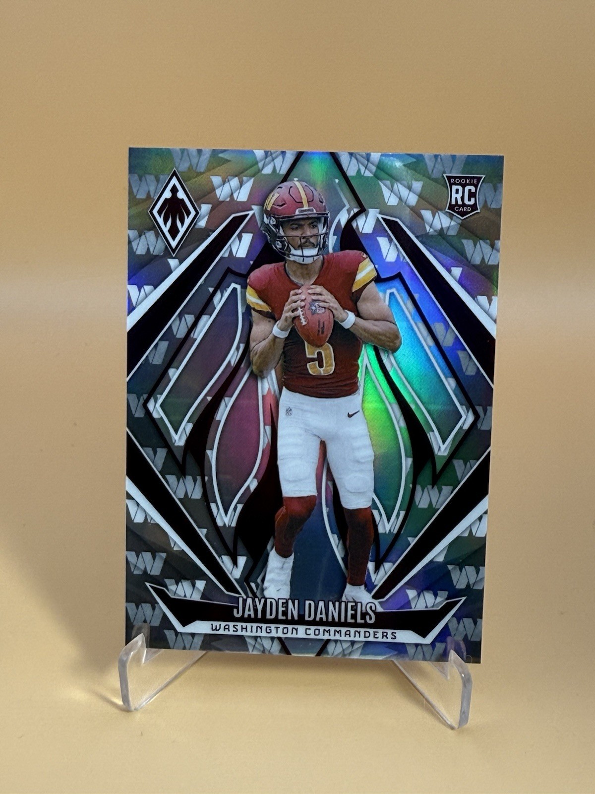 2024 Panini Phoenix - Team Logo Jayden Daniels  /299 (RC) #198 Commanders