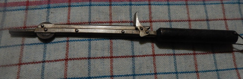 vintage spring action flint sparker black wood handle