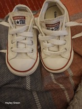 Image of These are white Converse Chuck Taylor All Star toddler low-top sneakers.