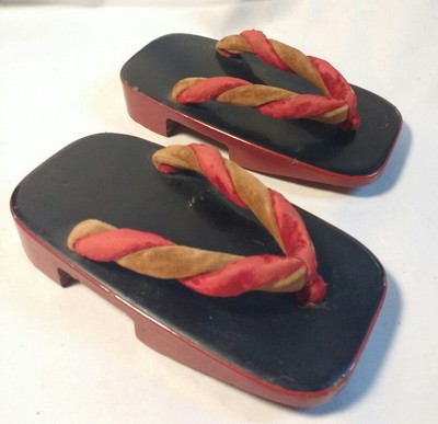 black wooden sandals