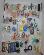 VINTAGE MIXED LOT OF 50 SEALED CEREAL PREMIUMS/TOYS Kellogg’s-Disney Etc....