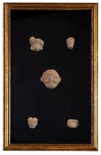 A Framed Group of Five Pre Columbian Heads Terracotta Fragments