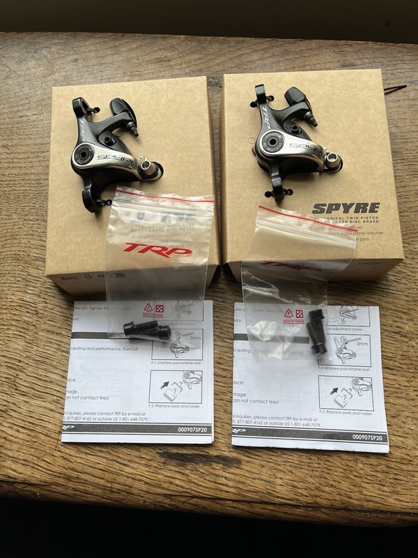 A pair of TRP Spyre Disc Brake Post Mount Calipers Black