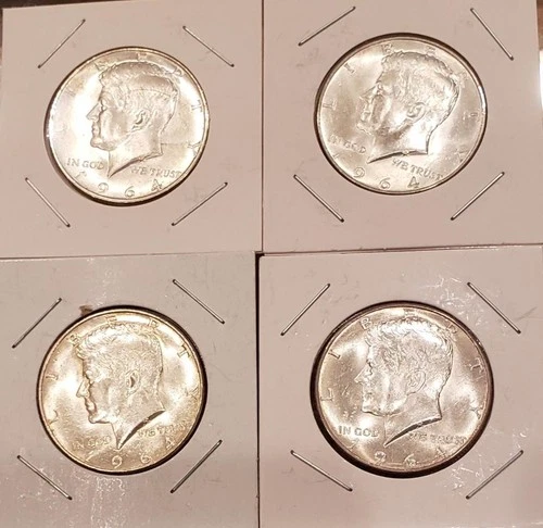 Four 1964 Kennedy half dollars