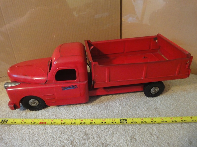 Vintage pressed steel, 20" Structo Toys dump truck semi with fireball engine.