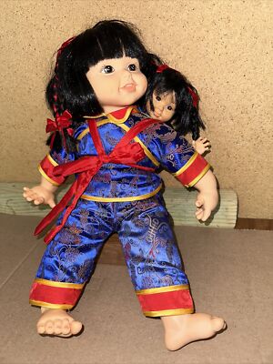 1996 Poupée plastic Chinese Ruby doll Soft Bodied With Baby Doll at Back.