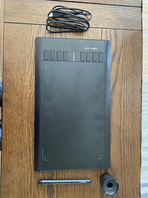 Electronic drawing tablet with pen.