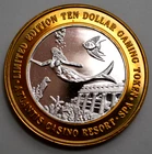 $10 999 SILVER GAMING TOKEN ATLANTIS CASINO RENO, NV,  MERMAID CORALS FISH,N R $