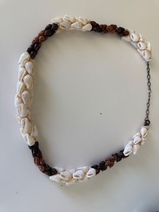 Niihau shells. This item was made in Hawaii, and is at least 80% Niihau shell.