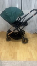 Green lejoux baby pushchair stroller with baby changing bag