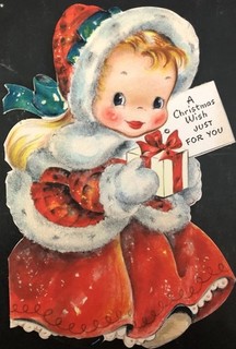 Biglietto di auguri di Natale vintage ragazza carina in bundle bordo floccato che tiene regalo augurio