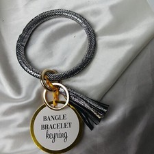 SILVER COLORED BRACELET KEYCHAIN WITH TASSEL
