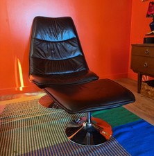 Black Mid Century Italian Leather "Tilt and Swivel " Chair and footstool treated