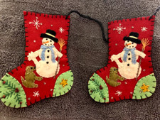 Handmade felt plush snowman on a Christmas stocking primitive style ornament