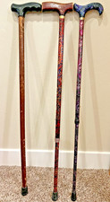 Lot of 3 walking canes including two decorative adjustable canes, 1 wood