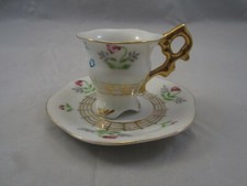 Made In Japan Miniature Three Footed Teacup and Saucer Vintage.