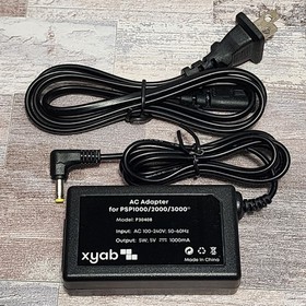 Sony PSP-1001 Console with Battery, Charger and 3 Games Bundle - USA