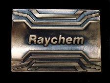 TJ11136 VINTAGE 1981 **RAYCHEM** ADVERTISEMENT SOLID BRASS BELT BUCKLE