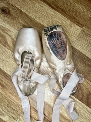 heavily used pointe shoes- fully broken in, worn on stage
