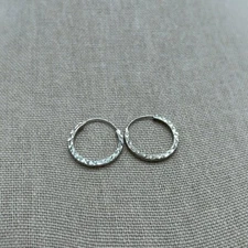 Sterling Silver Diamond Cut Huggy Hoops, not marked but Acid tested for Silver.