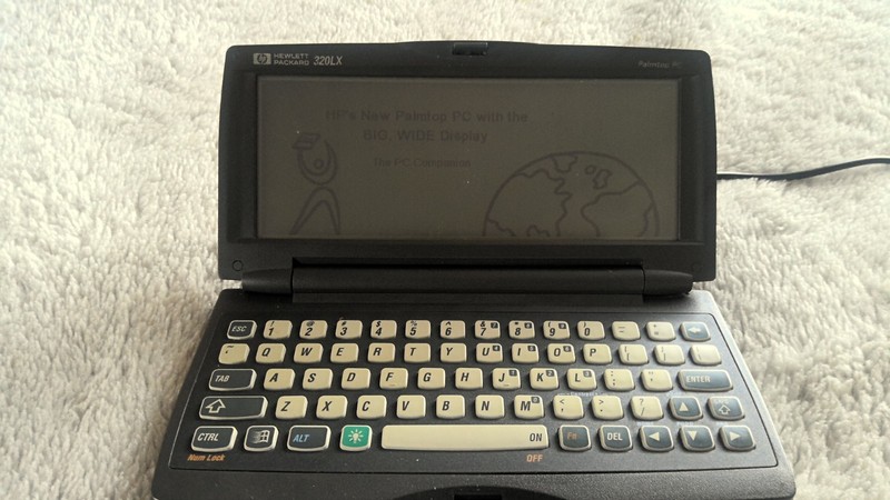 HEWLETT PACKARD 320LX WITH CHARGER AND PEN