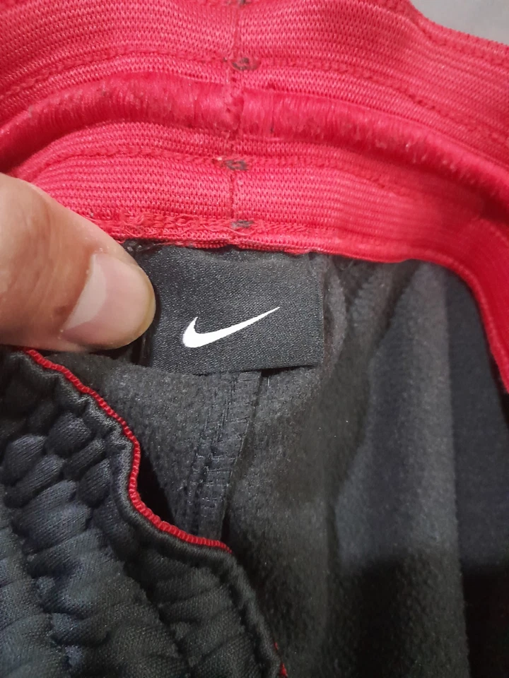 Pantalones deportivos Nike para hombre LT cónicos grises rojos Swoosh cintura elástica puños deportivos Foto 3 de 4