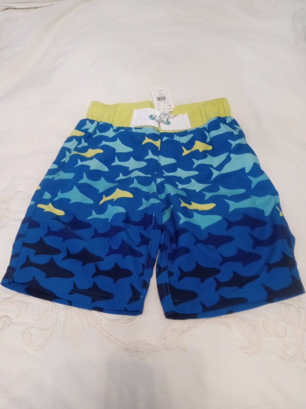 Boden boys new with tags swim board shorts size 11/12 fish/shark theme