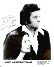 JOHNNY CASH SIGNED 8x10 PHOTO      GREAT POSE WITH HIS WIFE     RARE     JSA LOA
