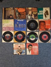 Lot of vintage 7-inch 45 RPM vinyl records W/sleeves featuring classic Artist