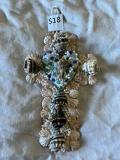Shell Cross Featuring King Crowns And Kitten Paws With a Whelk Center