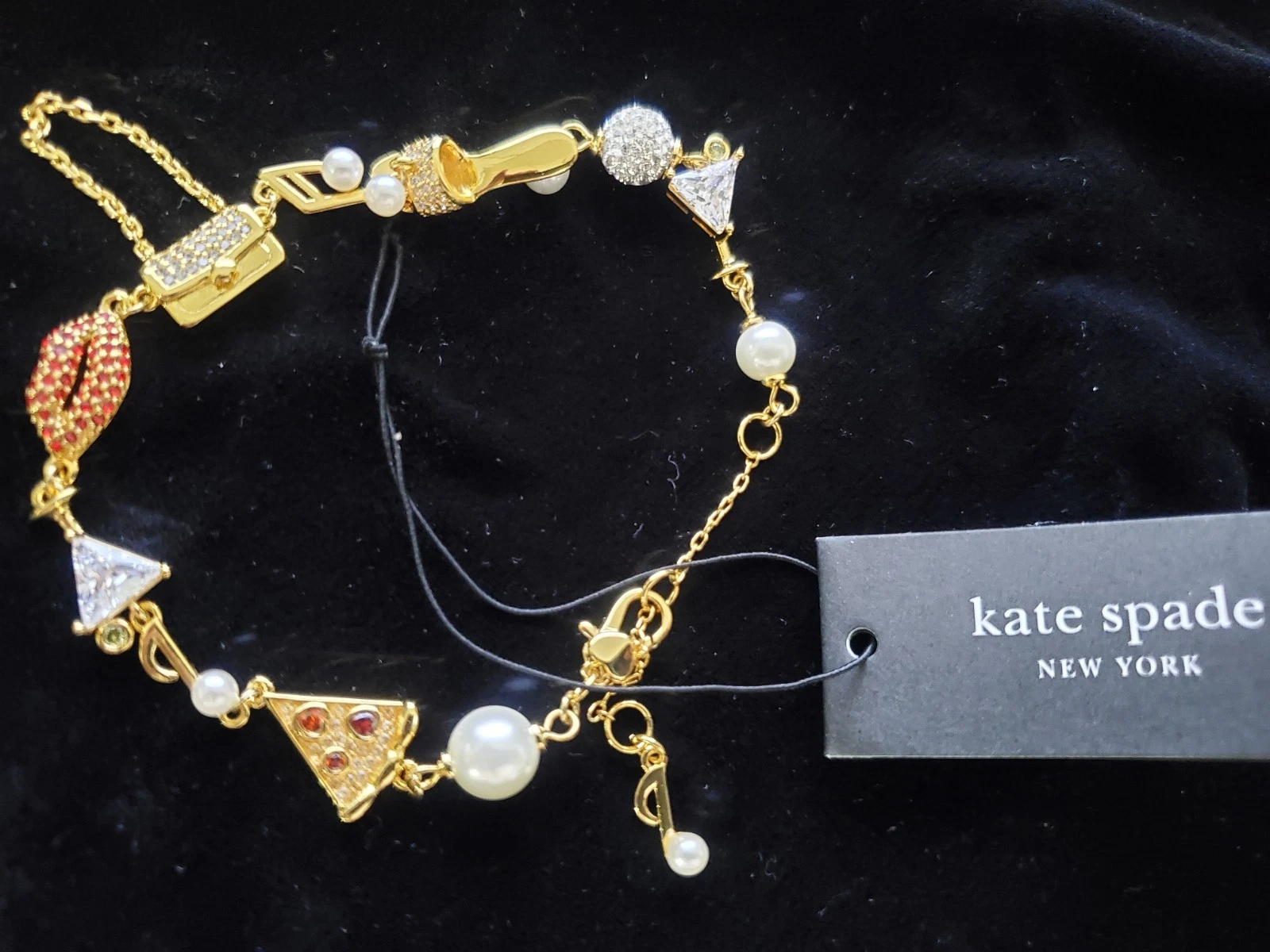 Bracciale con ciondolo Kate Spade tono oro Hit The Town finta perla e cristallo 