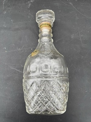 vintage James E. Pepper whiskey decanter made of clear diamond-patterned glass.