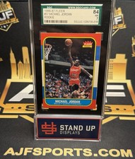 1986-87 Fleer - Michael Jordan #57 (RC) Rookie Card SGC 7. rookie card picture