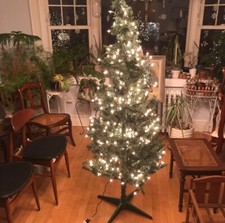 Artificial Christmas tree built on stand Approx 5  5  Tall X 2  Wides W/ Lights