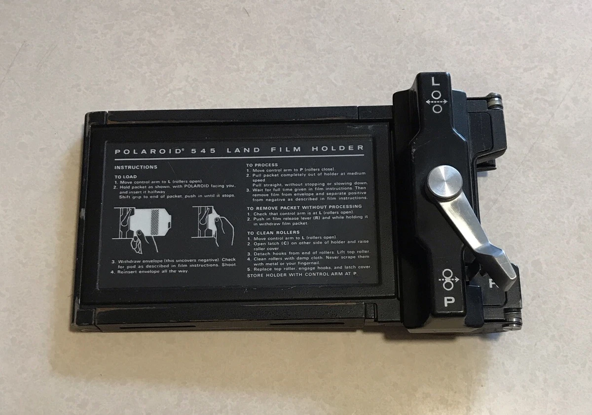 Polaroid Land Camera 1000 & Q-Light electronic flash (front) - a photo