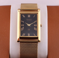 Vintage Seiko Slim Quartz Men's Wrist Watch Black Dial with Gold Bracelet.