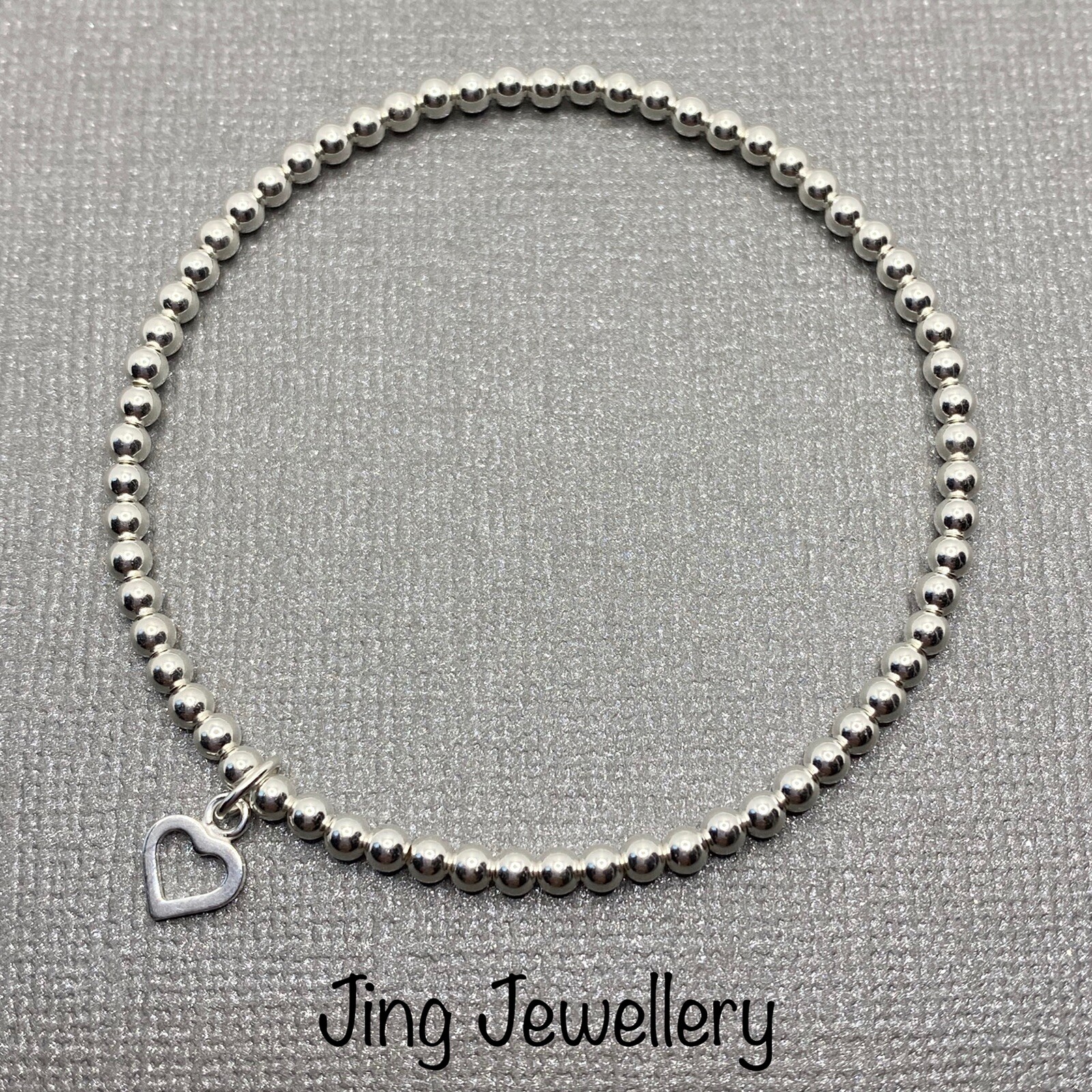 Sterling Silver Stretch Beaded Bracelet With Heart Charm. Handmade