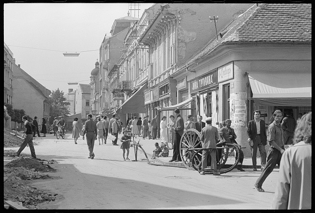 Photo:[People in a street in a commercial district, Belgrade, Yugoslavia]