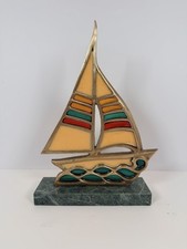 Vintage brass and stained glass sailboat sculpture with a granite base. Enesco