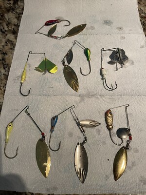 all white fishing pole Jacob Wheeler 2.0 – Duckett tone finish and a FishUSA Dai-Riki 710 Streamer Colour:Walleye Dream clam hook