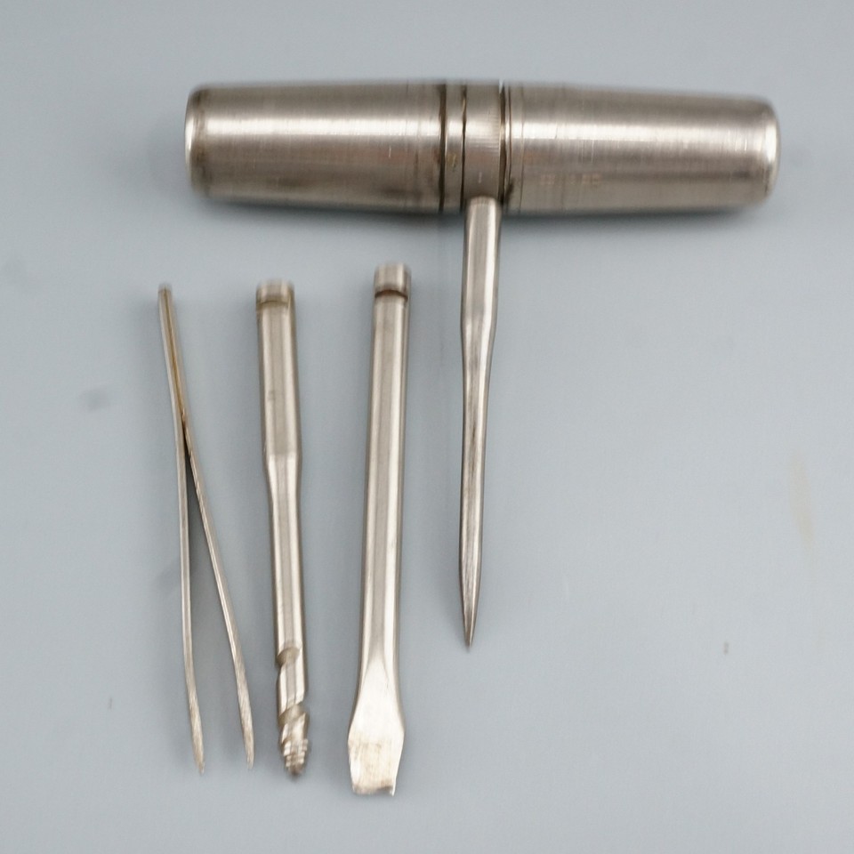 A tiny German brass barrel that unfolds into a 4-in-1 corkscrew multi-tool — the kind of clever pocket gadget that would stop a party cold.