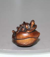 antique Japanese carved wood netsuke of a immortal on a peach. 19th century. EDO