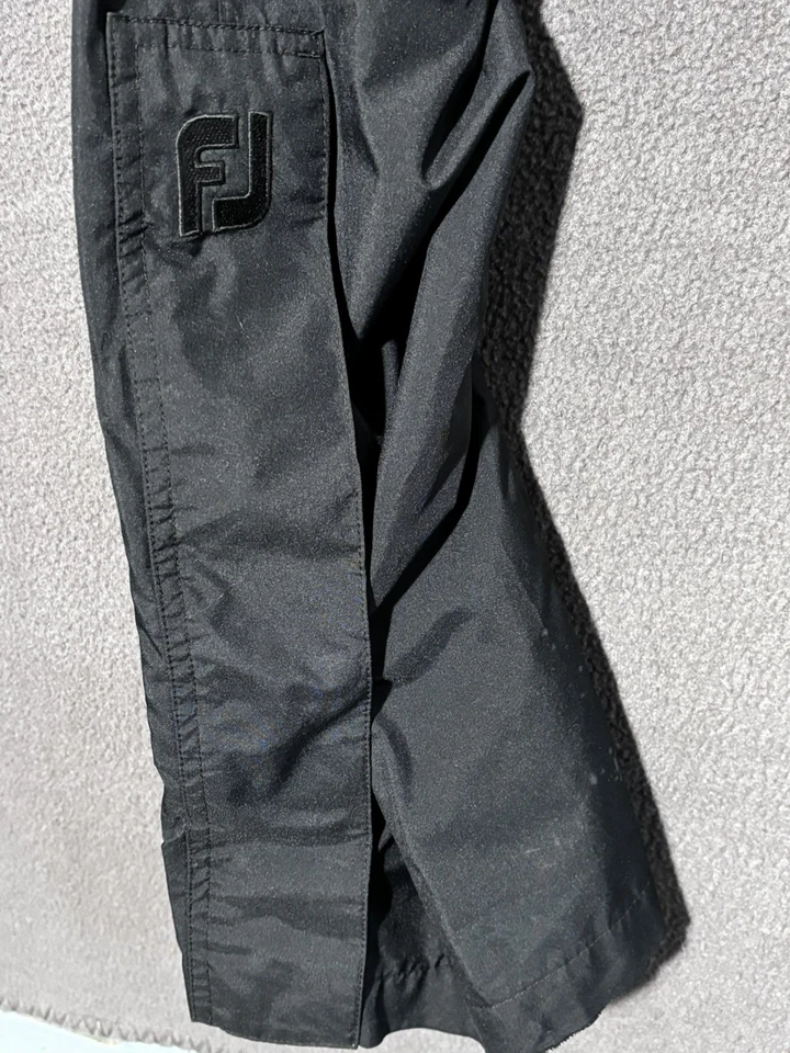 Pantalones de lluvia FootJoy DryJoys para mujer S negros impermeables para golf logotipo FJ pierna con cremallera Foto 3 de 4