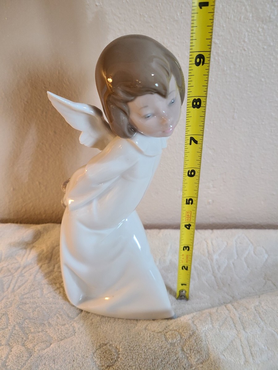 Lladro 4960 Curious Angel Figurine with Lantern behind her