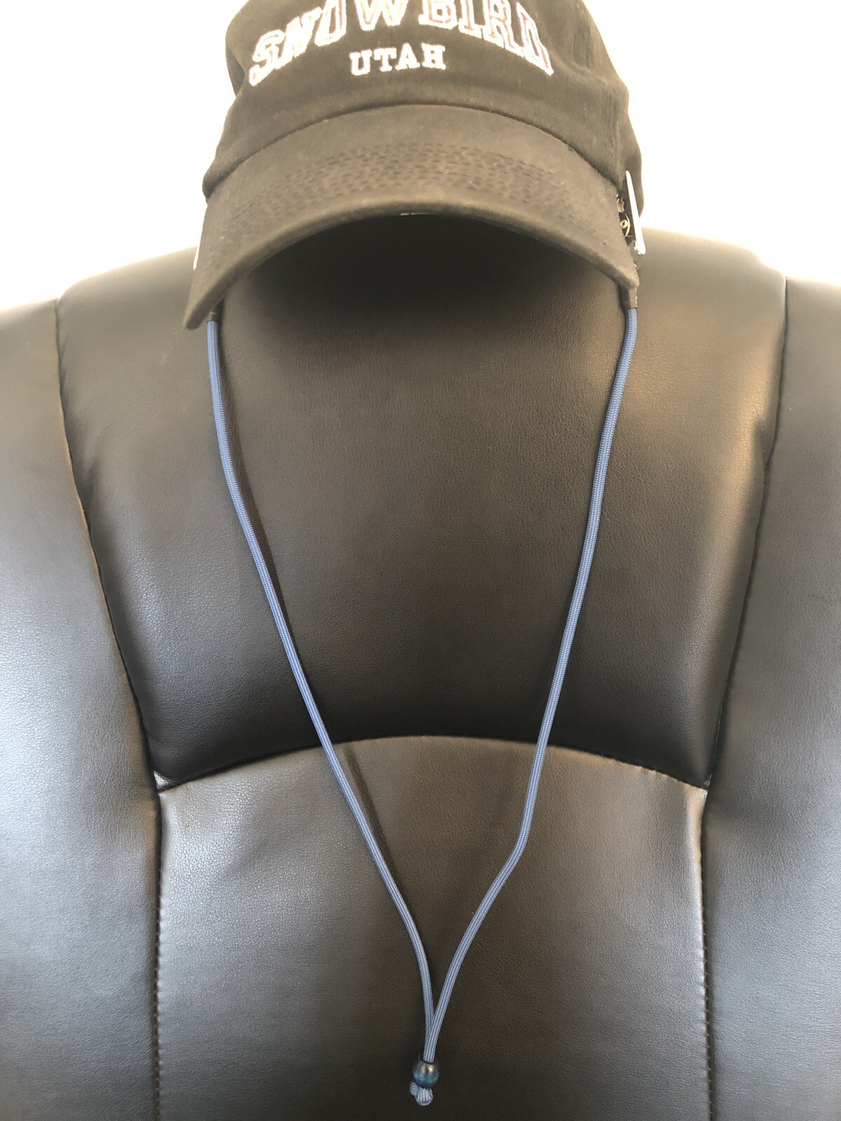 Dark blue clip-on hat strap for secure fit and style-image